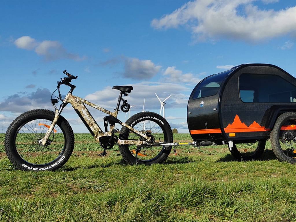 The Himiway Cobra eBike on a rugged trail, highlighting its 750W geared hub motor, 26*4.8 Super Fat Tires, and Shimano 7-speed gear shift system, ready for adventure.
