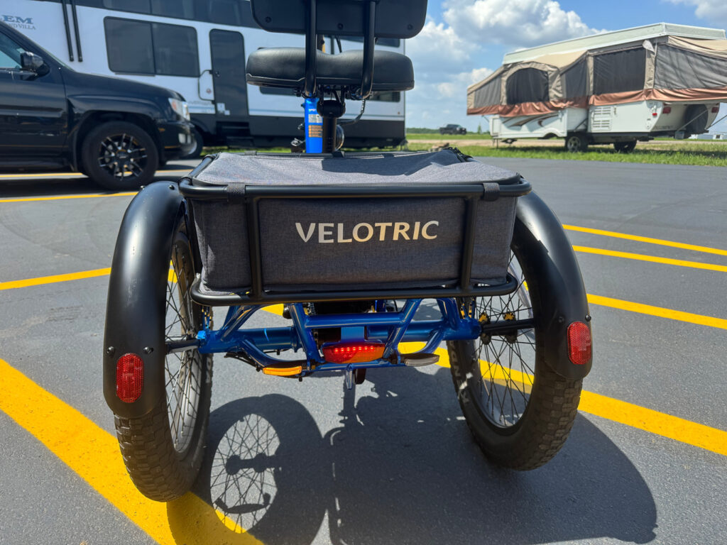 Velotric Triker showing the stable three-wheel design with differential rear-wheel system Velotric Triker showing the stable three-wheel design with differential rear-wheel system