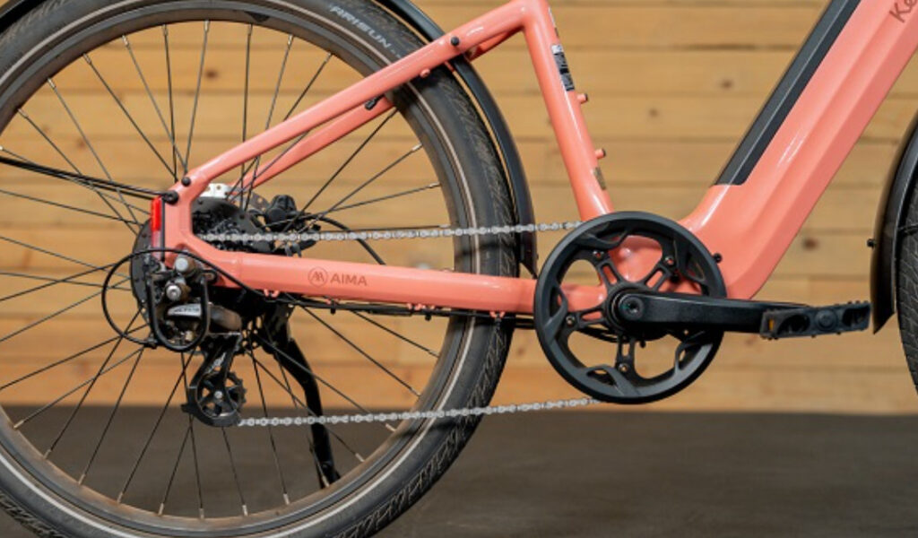 Key West Ebike in Coastal Blue color on a scenic waterfront path