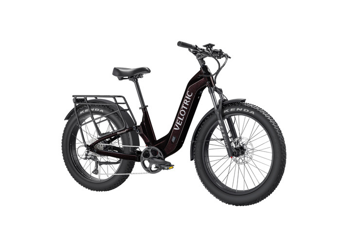Velotric Nomad 2X in Fig, front three-quarter view showing the air fork and rear shock Velotric Nomad 2X in Fig, front three-quarter view showing the air fork and rear shock